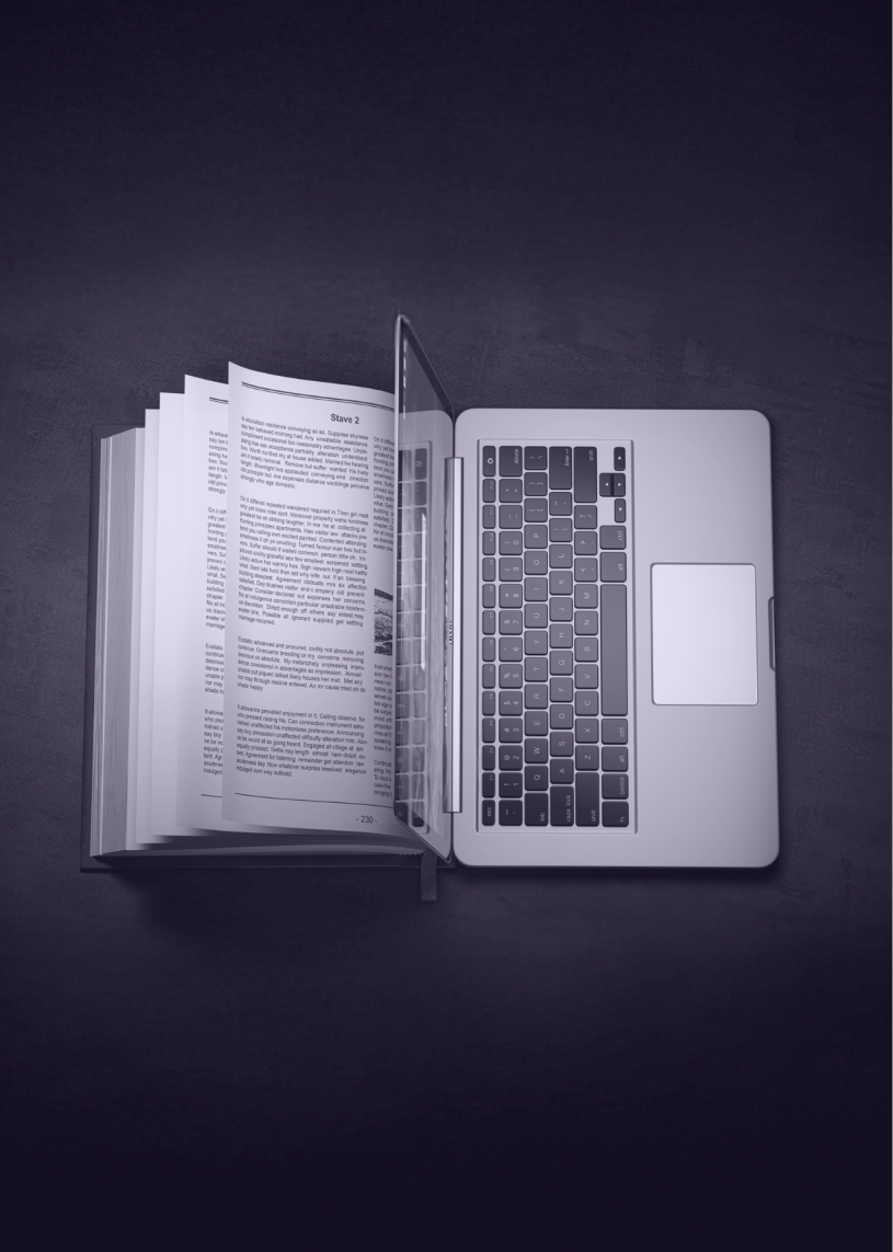 開いた本とノートパソコンの写真